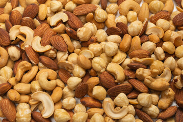 Mix of nuts isolated on white background. Top view.