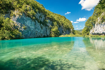 Fototapeta na wymiar view of the blue lakes and green trees in Plitvice lakes in Croatia