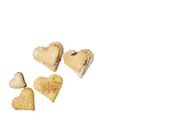 Heart-shaped cookies on a white plate. Background for Valentine's Day.