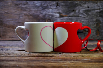 Two cups symbolizing love. Valentine's Day,  romantic symbol of love. Selective focus, blurred backgrounds