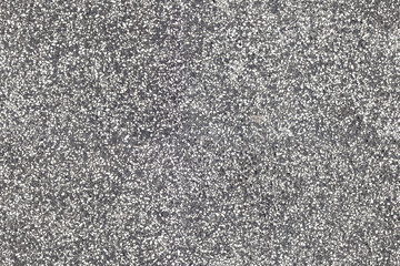 Asphalt with small stones texture - real seamless suitiable to use as a repetead pattern 