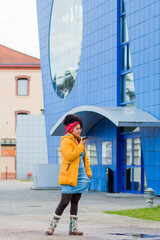 portrait of young woman in the city of Roanne with mobile phone