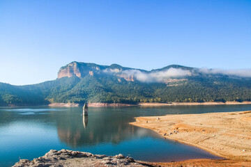Sau Reservoir. Mountainous landscape of the Sau reservoir with its historic church in a sunny day....