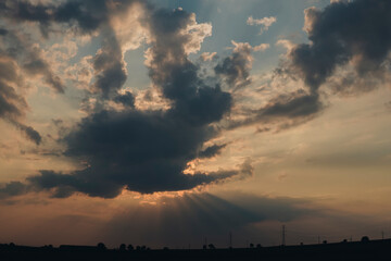 sun hiding behind cloud