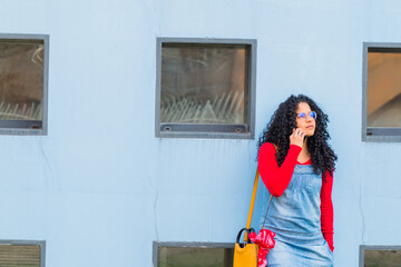 portrait of young woman in the city of Roanne with mobile phone