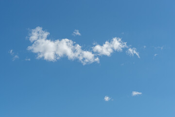 Isolated white puffy cloud in a blue sky