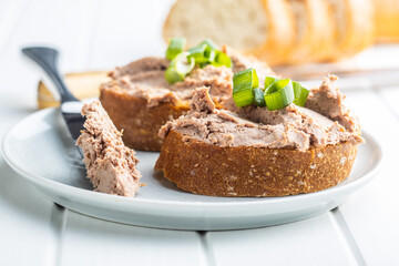 Liver pate on sliced baguette.