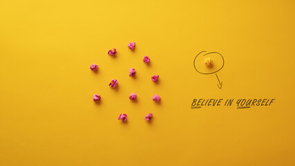 Believe in yourself message spelled on yellow background