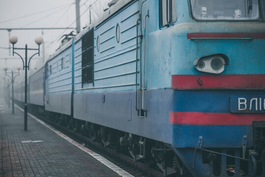 Truskavets, Ukraine - December 2020: Electric locomotive VL10 with a freight train awaiting departure on the platform of the railway station.  Ukrzaliznytsia. Ukrainian railways.