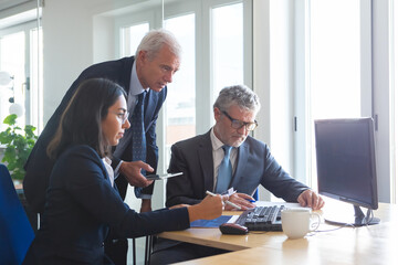 Fototapeta premium Professional content business partners working with statistics. Confident businesspeople meeting in office and discussing data in charts together. Teamwork, business and partnership concept