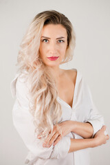 Obraz premium tender charming long-haired woman in white shirt