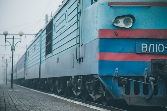 Truskavets, Ukraine - December 2020: Electric locomotive VL10 with a freight train awaiting departure on the platform of the railway station.  Ukrzaliznytsia. Ukrainian railways.