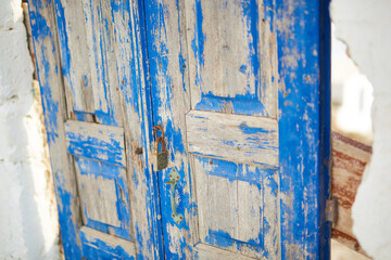 old door painted with blue paint