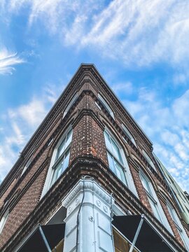 Vintage Building profile looking up at a bright blue sky