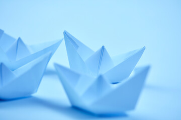 paper boats on the white