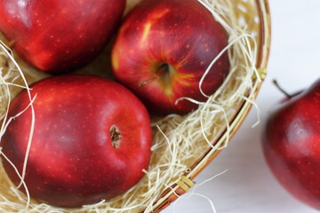 Ripe red apples on table close up, on white background. Apple harvest, agricultural, natural fruits 