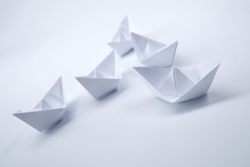 paper boats on the white
