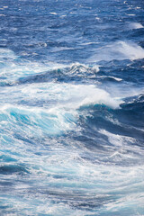Fototapeta na wymiar Rough waves in the middle of the sea