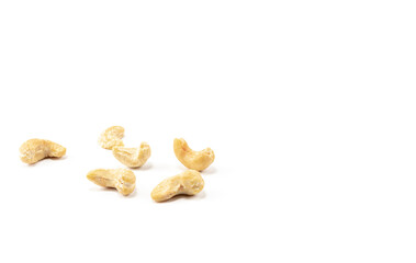 Fototapeta na wymiar A few dried cashew nuts on a white background