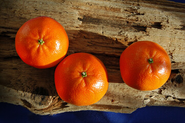 Tangerines on an old weathered board