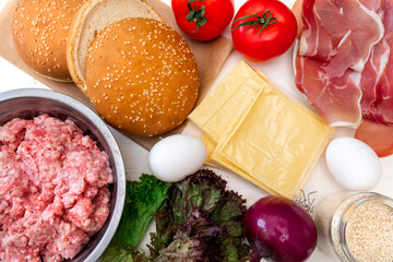 burger cheeseburger hamburger tomato minced meat bun greens onion cheese ingredients