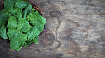 spinach on a wooden background. view from above. Copy space