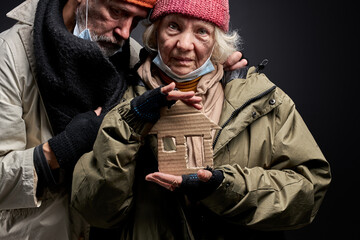 bums elderly couple want to be at home in warm place, need shelter and family. they hope for the...