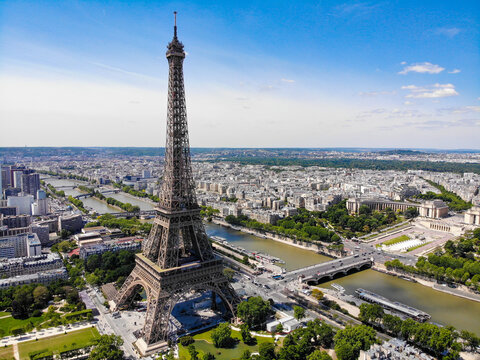 Close-up shot of the Eiffel tower on a drone from a height. Eiffel tower from a height. Paris, France. - Powered by Adobe