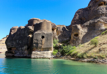 Historic rock tombs and caves around Egil dam lake in Diyarbakir, Turkey. 