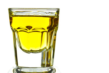 On a white background on the left side of a glass with whiskey close-up. On the right is a place for an inscription