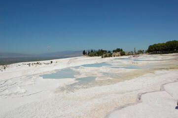 Panoramic view of the ancient Roman baths of Pamukkale (Anatolia, Turkey). Next to the Roman ruins of Hierapolis. Natural terraces. 
