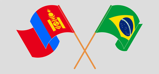 Crossed and waving flags of Mongolia and Brazil