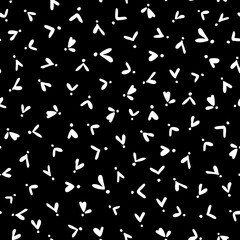 Hearts with dots flower like seamless repeat minimal pattern. Random placed, vector millefleurs all over surface print on black background.