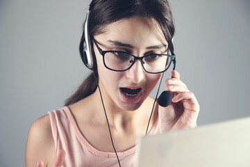 telemarketer working in office with laptop