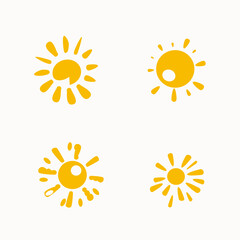 Set of painted yellow suns. Vector solar symbols set.