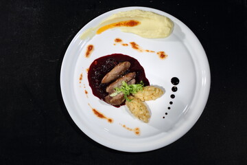 Peking duck with mashed potatoes and cranberry sauce