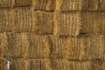 Closeup of Stacked Square Yellow Hay Bales