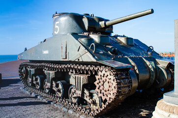 Westkapelle,Netherlands,August 2019. A tank,remnant of the Second World War,serves as a memorial along the road that surmounts the artificial hill that protects the town from the sea.