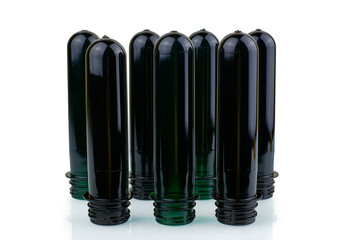 PET preforms on a white background with reflection. Manufacturing of plastic PET bottles
