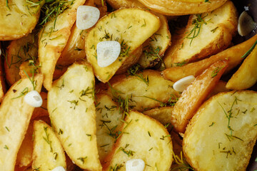 roasted rosemary garlic potato wedges on a plate