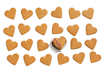 Romantic pattern with ginger cookies in the shape of hearts isolated on a white background. Valentine's day cookies background. Love concept. View from above.