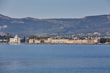 Fototapeta na wymiar Kos Town Harbour and Neratzia Castle wall view in Kos Island.