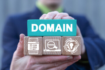 Domains name registration internet website hosting technology on mobile devices. Man holds colorful blocks with domain conceptual banner. Web Hosting Concept. - obrazy, fototapety, plakaty