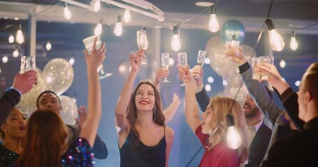 Carefree group of multirace young attractive people spending corporate party celebrating holiday or successful day dancing in company together. - Powered by Adobe