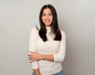 Obraz premium Beautiful young woman with long black hair wearing wirst watch, Youthful and radian girl with natural make-up