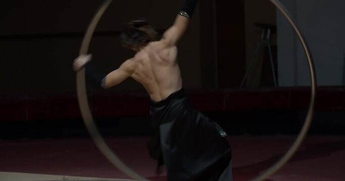 Circus artist is doing wheel gymnastics, training before the performance, 4k