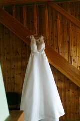 Fototapeta na wymiar The wedding dress is hanging in the house.