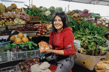 Person at the market, Latin American vegetable seller