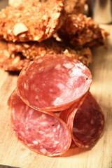 Slices of ham on a wooden board.   