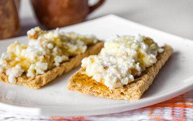 breakfast of bread with cottage cheese and honey